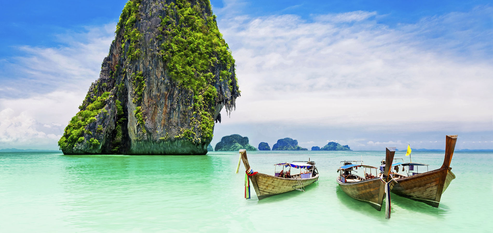 Home 1900x900 Original Asia Rondreis Thailand Vakantie Istock Railay Beach Krabi zuid strand longtail boot